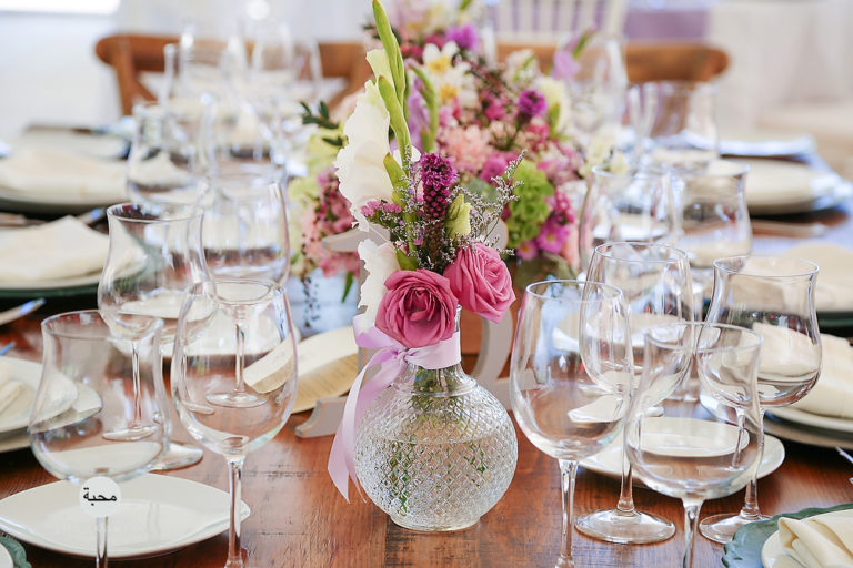 a dining table filled with wine glasses